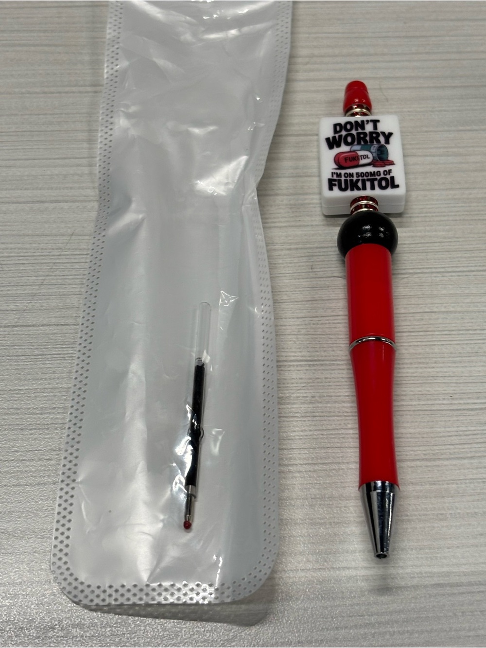 Novelty Red Pen with 'Don't Worry' Charm
